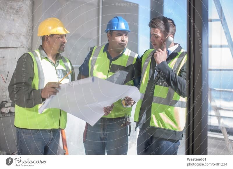 Architect and construction workers discussing construction plan construction site Building Site sites Building Sites construction sites Blueprint Blueprints