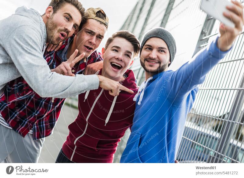 Young basketball players with smartphone, selfie Motivation Incentive motivating Motivations laughing Laughter outdoors outdoor shots location shot