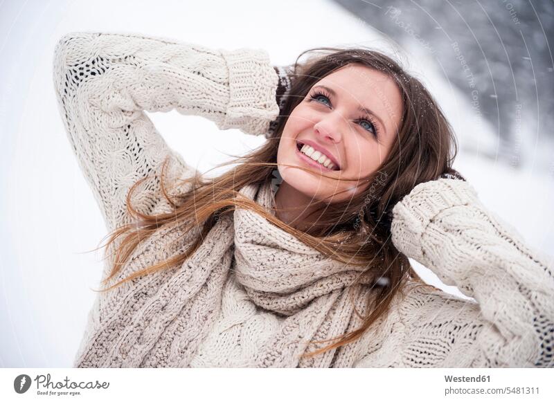 Young woman having fun in snow smiling smile Fun funny females women happiness happy snowing Adults grown-ups grownups adult people persons human being humans