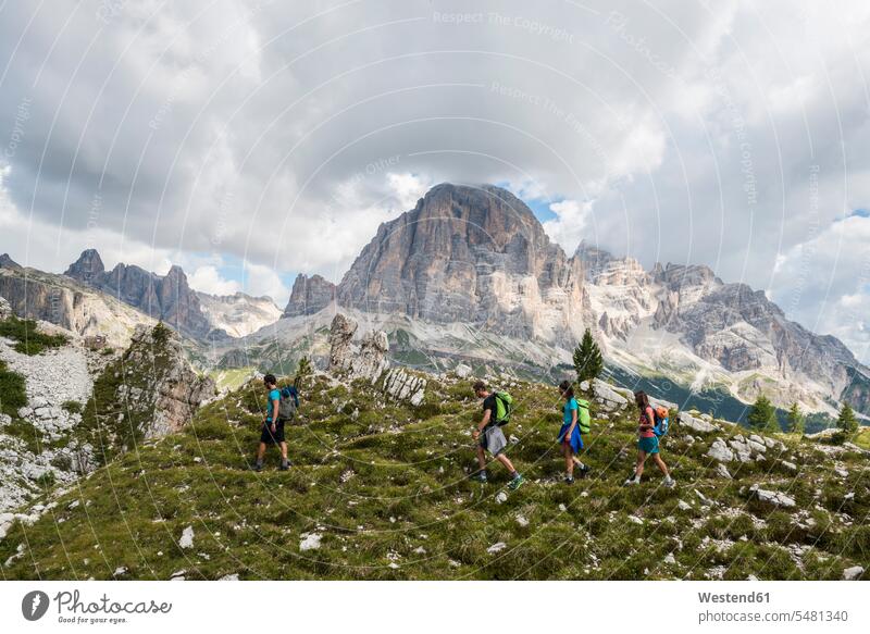 Italy, Friends trekking in the Dolomtes hiking climber alpinists climbers mountaineer Mountain Climber mountaineers Mountain Climbers mountaineering active