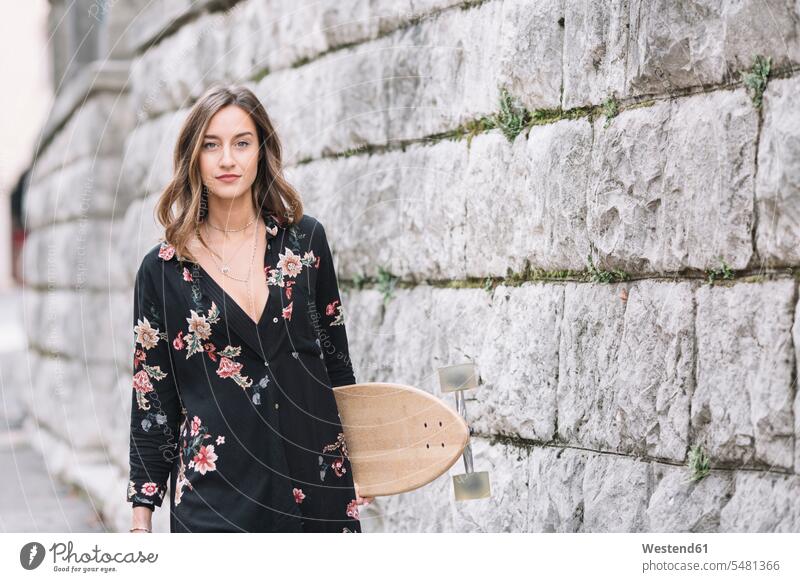 Portrait of fashionable woman with skateboard Skate Board skateboards females women portrait portraits Adults grown-ups grownups adult people persons