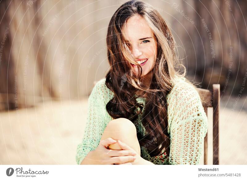 Portrait of smiling young woman with long brown hair smile females women Adults grown-ups grownups adult people persons human being humans human beings portrait