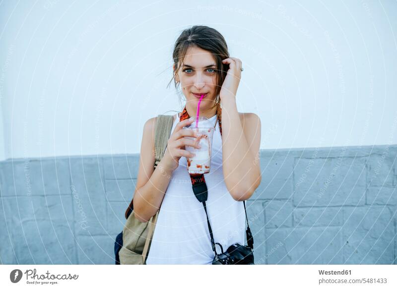 Portrait of young woman drinking a smoothie females women Smoothies Adults grown-ups grownups adult people persons human being humans human beings Drink