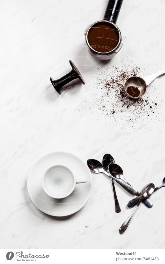 Empty espresso cup, spoons and pressurized portafilter on white marble tea spoon Teaspoon tea spoons espresso cups coffee powder Things That Go Together