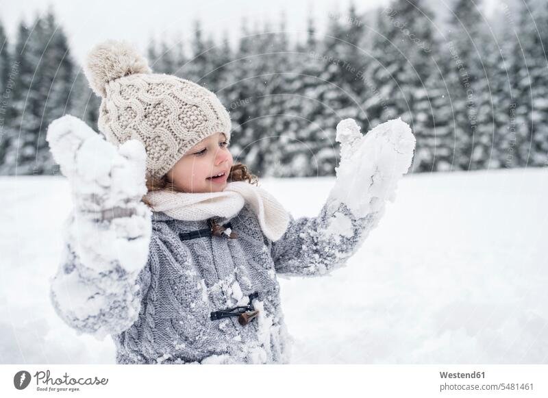 Happy girl in winter landscape females girls hibernal child children kid kids people persons human being humans human beings snow weather caucasian