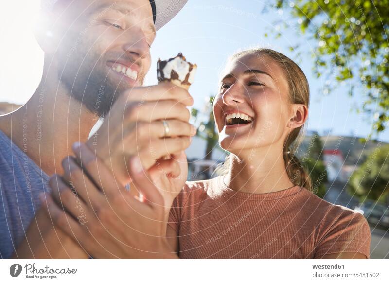 Young couple with ice cream cone eating twosomes partnership couples Sweet Food sweet foods food and drink Nutrition Alimentation Food and Drinks people persons