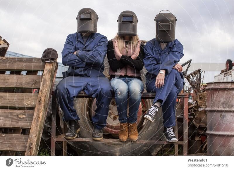 Three people wearing welding helmets outdoors colleagues worker blue collar worker workers blue-collar worker welding mask Welding Masks Welder's Visor Job