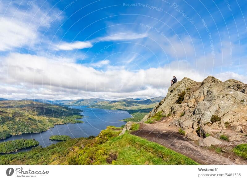 UK, Scotland, Highland, Trossachs, tourist looking from mountain Ben A'an to Loch Katrine rock rocks scenics sceneries scenery landscape scenic view landscapes