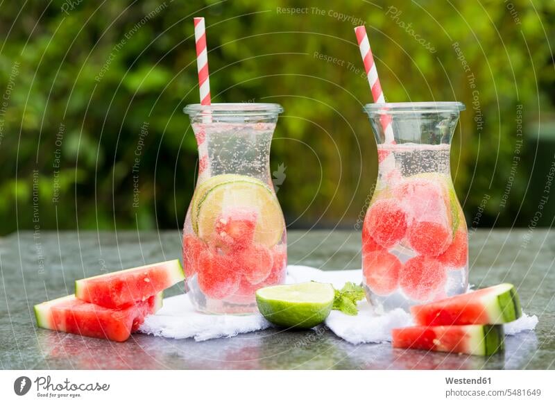 Two carafes of infused water with watermelon and lime sliced Watermelon Watermelons Water Melon Water Melons Carafe day daylight shot daylight shots day shots