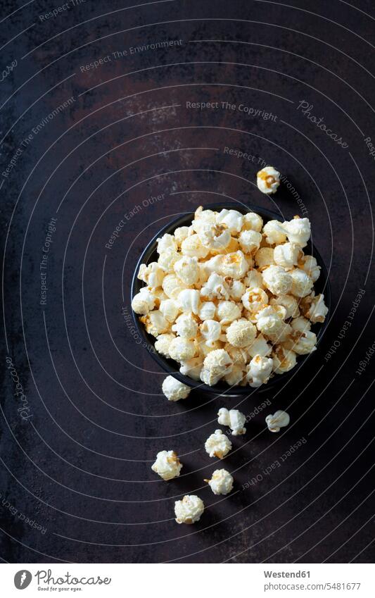 Bowl of popcorn on rusty background overhead view from above top view Overhead Overhead Shot View From Above ready to eat ready-to-eat prepared close-up
