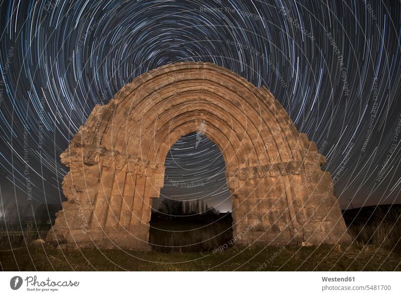 Spain, Sasamon, Arco de San Miguel de Mazarreros with star trails in the background night by night at night nite night photography landmark sight
