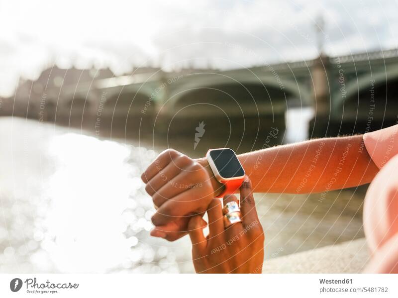 UK, London, close-up of woman using her smartwatch near Westminster Bridge females women smart watch wrist watch Wristwatch Wristwatches wrist watches Adults