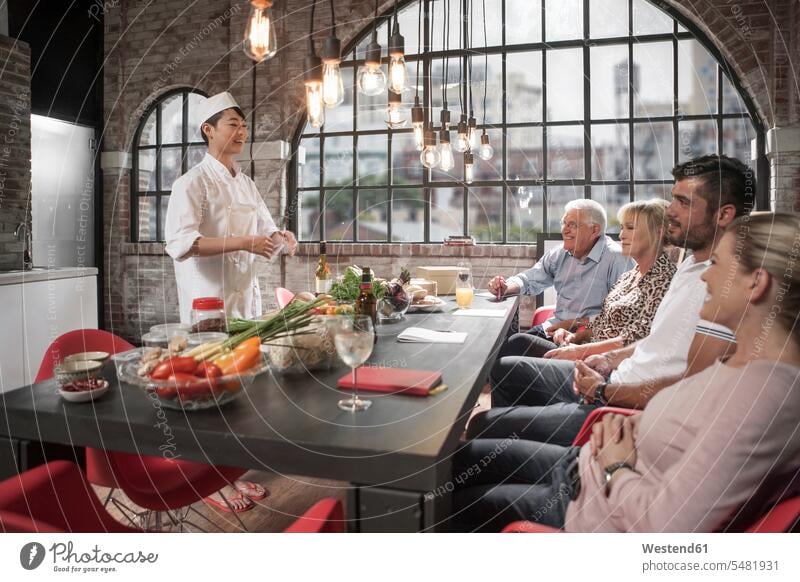 Group of people taking cooking course explaining female cook ingredient ingredients Vegetable Vegetables learning cooking class cooking lesson chef cooks Chefs
