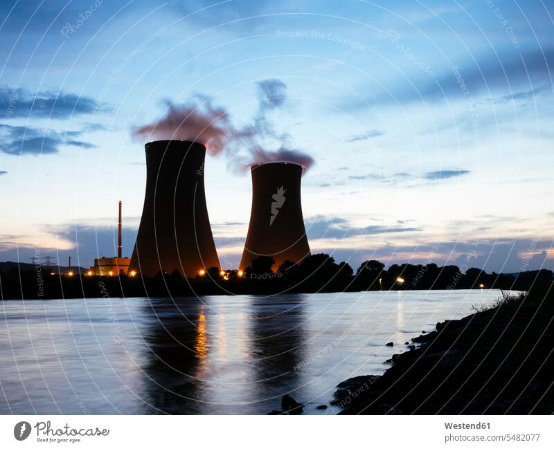 Germany, Lower Saxony, Grohnde, Grohnde Nuclear Power Plant along the Weser river during sunset energy supply power supply Fuel and Power Generation