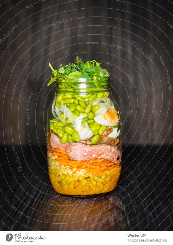 Salad in a jar with steak , boiled eggs, green beans and durum wheat rich in vitamines take away take out food takeout food close-up close up closeups close ups