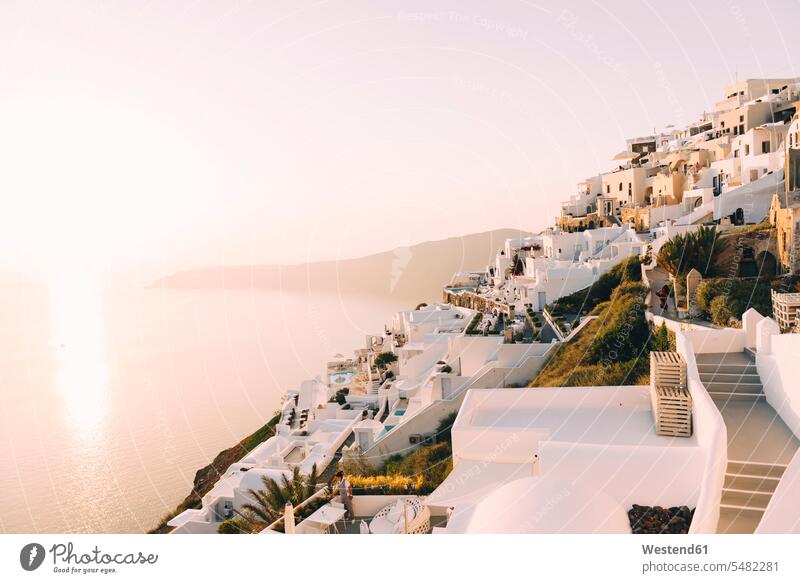 Greece, Santorini, Fira, white village view over the sea at sunset island islands townscape tranquility tranquillity Calmness evening light Greek villages View