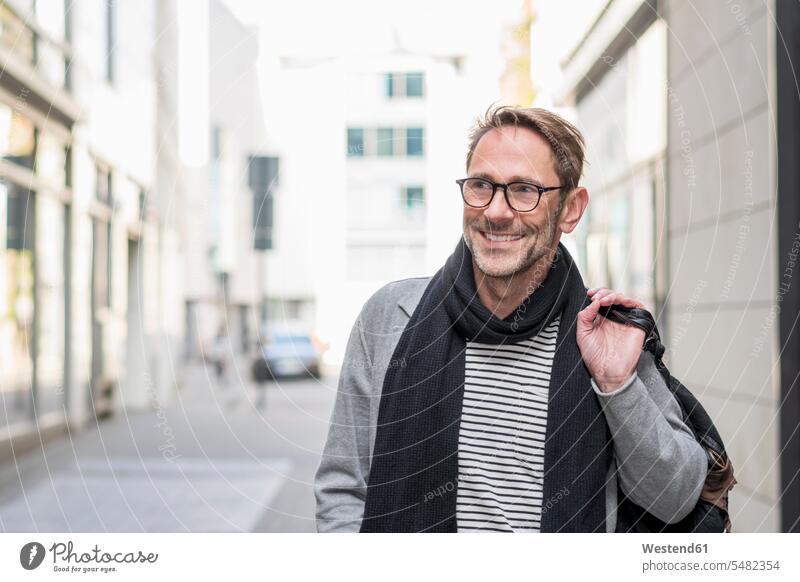 Portrait of smiling mature man with stubble and glasses men males portrait portraits Adults grown-ups grownups adult people persons human being humans