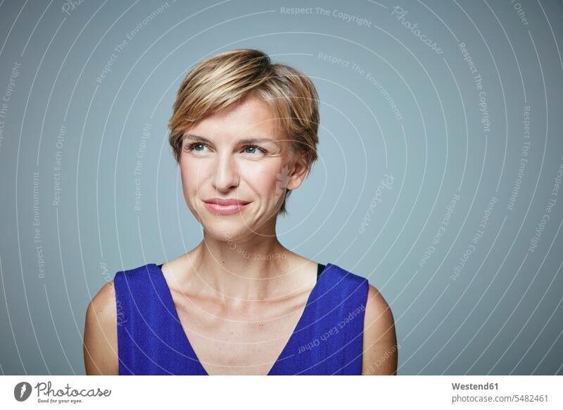 Portrait of smiling woman with short blond hair females women portrait portraits Adults grown-ups grownups adult people persons human being humans human beings