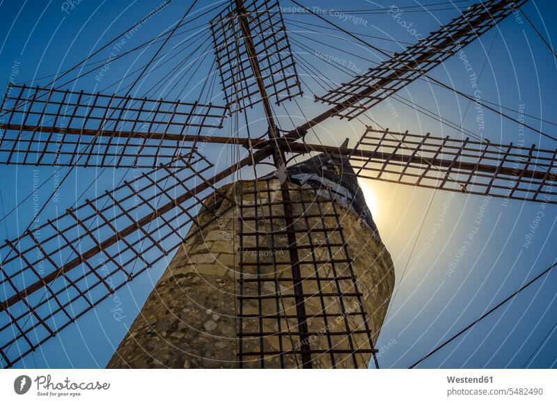 Spain, Mallorca, Manacor, wind mill against the sun windmills wind mills built structure buildings built structures Tradition traditional Traditions wind wheel