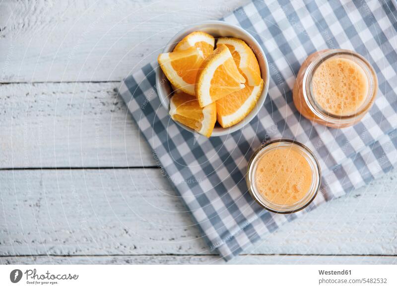 Orange, carrot, pineapple, ginger smoothie in jars food and drink Nutrition Alimentation Food and Drinks healthy eating nutrition studio shot studio shots