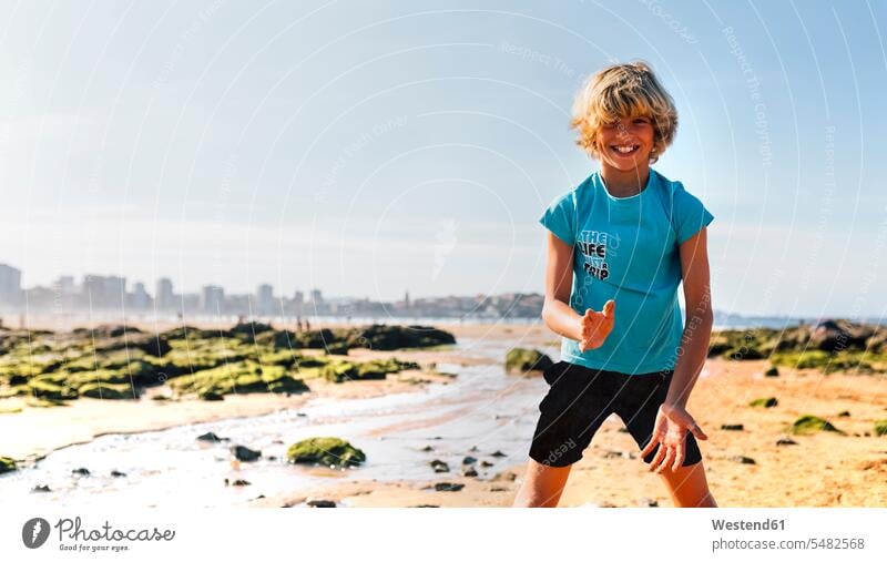 Portrait of blond boy on the beach boys males beaches portrait portraits child children kid kids people persons human being humans human beings smiling smile