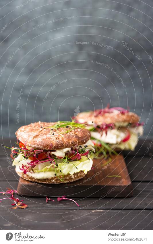 Veggie Burger, vegan, with salad, radish, tomato, rock chive food and drink Nutrition Alimentation Food and Drinks lettuce Salad granary roll cress cresses