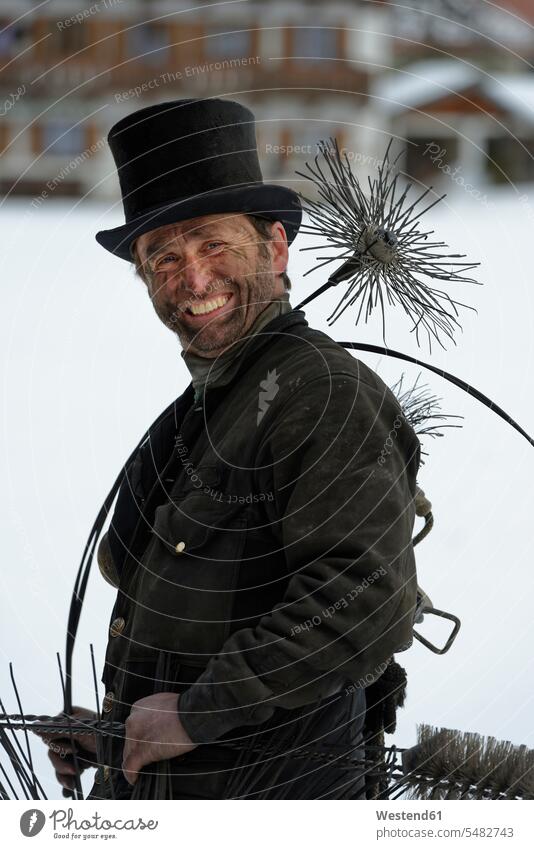 Germany, portrait of chimney sweep with top hat chimney sweepers portraits laughing Laughter positive Emotion Feeling Feelings Sentiments Emotions emotional