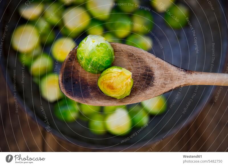 Fried Brussels sprouts on cooking spoon, close-up Cooking Spoon Cooking Spoons healthy eating nutrition wooden half halves halved prepared Frying pan