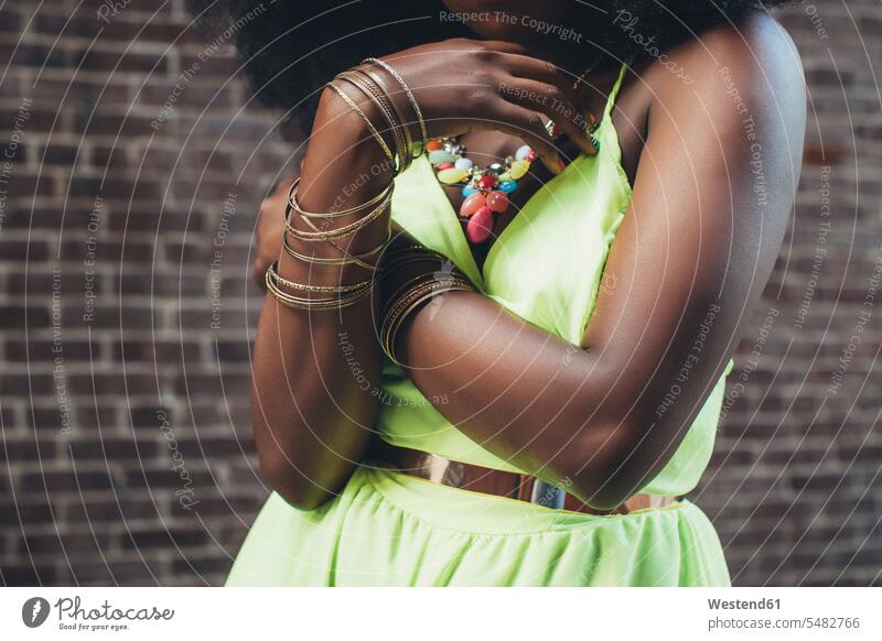 Woman wearing bracelets, close-up African-American Ethnicity Afro-American African American Ethnicity African Americans Afro-Americans brick wall brick walls