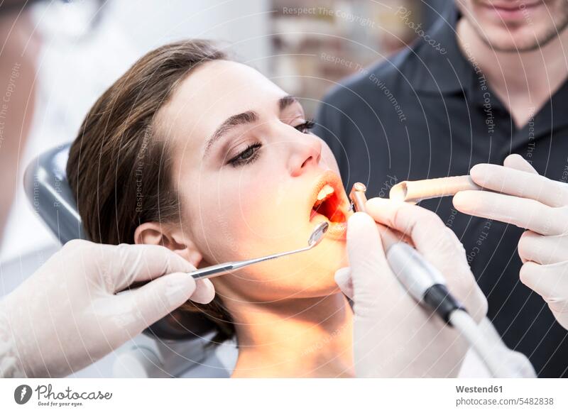 Young woman at the dentist receiving treatment dental care dental hygiene dental surgeon medical practice medical practices Doctors Office Doctor's Office