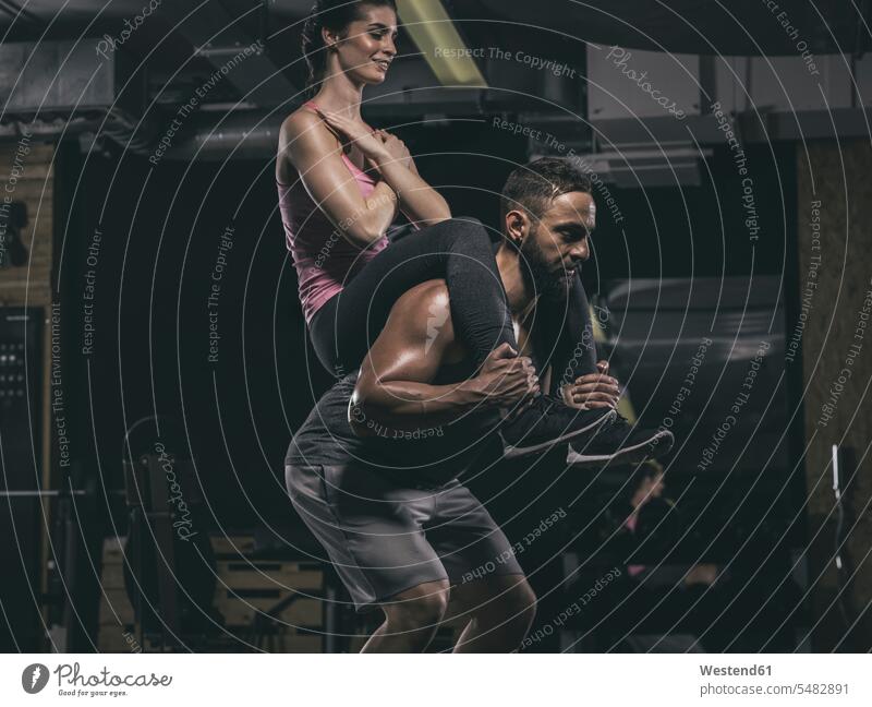 Fitness, couple in gym together athlete Sportspeople Sportsman Sportsperson athletes Sportsmen training Sport Training exercising exercise practising sit-up