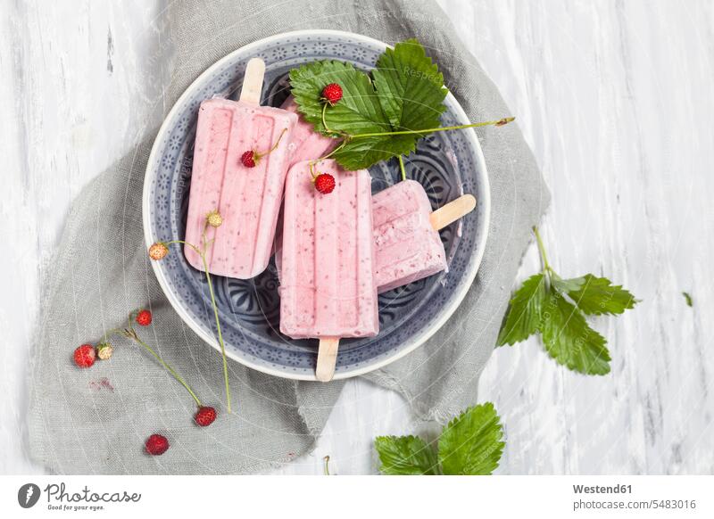 Homemade strawberry ice lollies with chia on plate Bowl Bowls Ice Lolly Iced Lolly Ice Lollies Iced-Lolly frozen sweet Sugary sweets fruit homemade home made