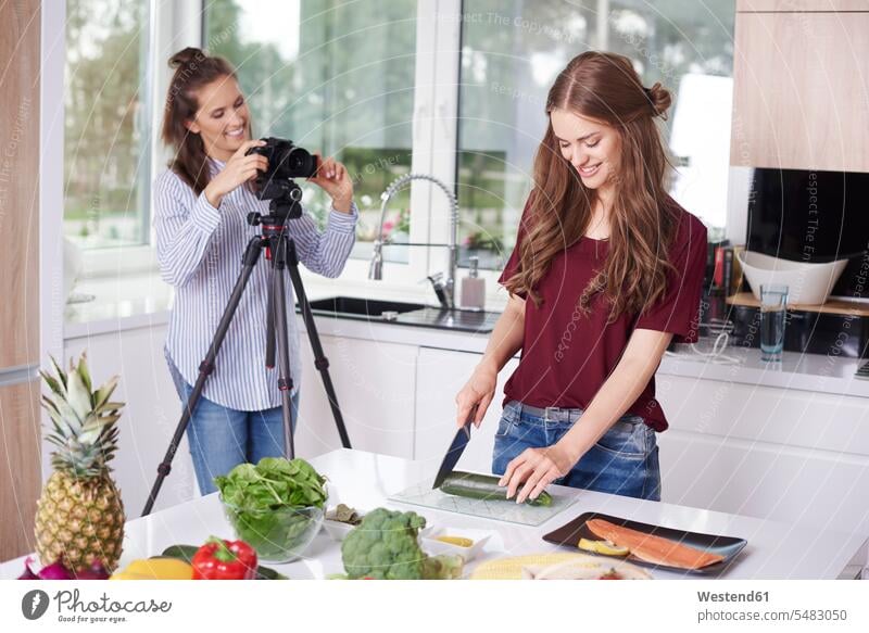 Women recording video for their food blog cook cameras smile human human being human beings humans person persons adult grown-up grown-ups grownup grownups