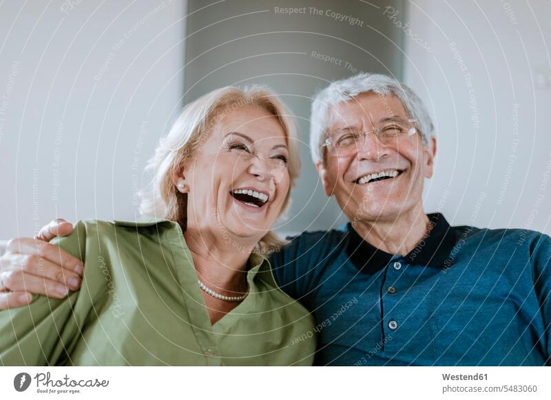 Happy senior couple at home twosomes partnership couples senior men senior man elder man elder men senior citizen people persons human being humans human beings