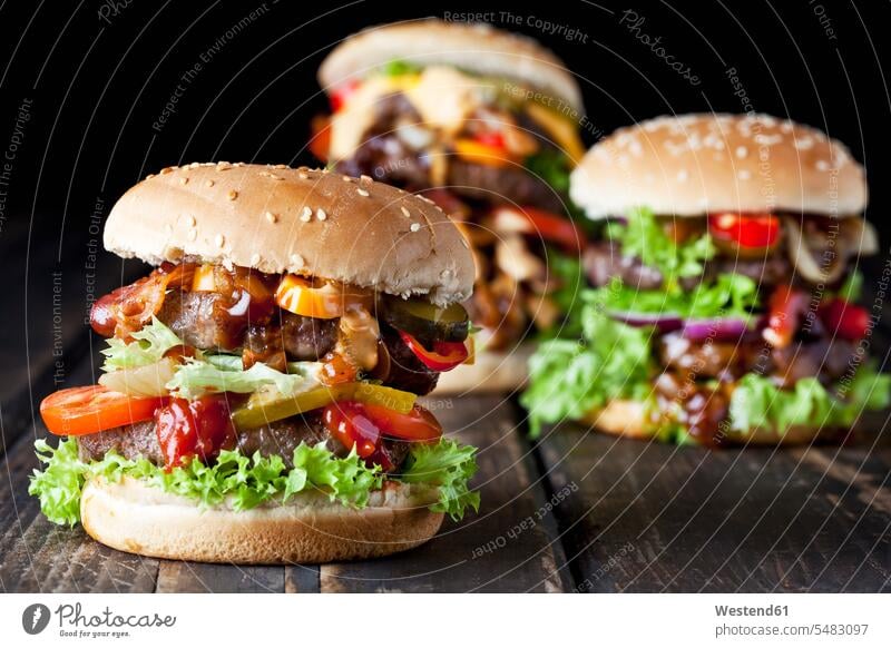 Three double burgers nobody bacon Bacons speck Tomato Tomatoes Cheese fatty lettuce leaf lettuce leaves Gherkin Pickled Gherkins onion ring onion rings