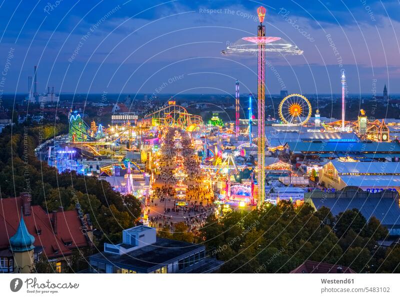 Germany, Bavaria, Munich, View of Oktoberfest fair on Theresienwiese in the evening funfairs kermis fairground fun fair fairgrounds fun fairs tourist attraction