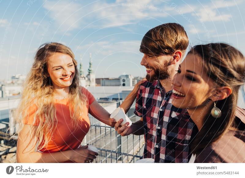 Austria, Vienna, Young people having a party on rooftop terrace caucasian caucasian ethnicity caucasian appearance european St Stephan's Cathedral