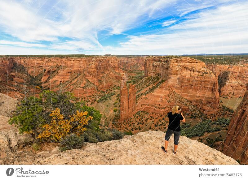 USA, Arizona, Navajo Nation, Chinle, Canyon de Chelly National Monument, tourist at Spider Rock needle rock rocks landscape landscapes scenery terrain sky skies