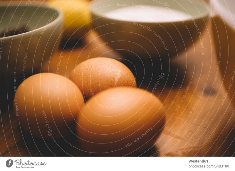 Eggs and bowls with ingredients for a cake nobody preparation prepare preparing indoors indoor shot Interiors indoor shots interior view Selective focus
