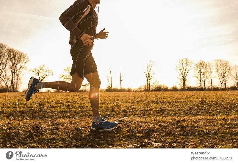 Man running in rural landscape man men males Jogging Adults grown-ups grownups adult people persons human being humans human beings fitness sport sports