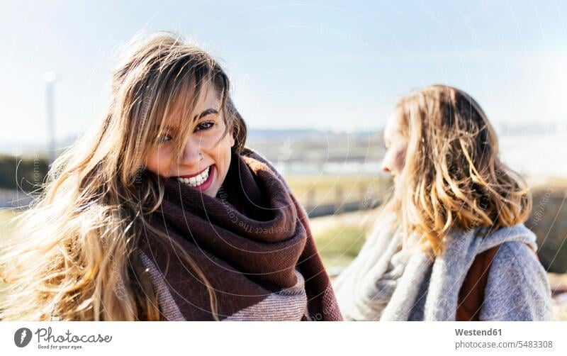 Portrait of happy young woman with friend outdoors caucasian caucasian ethnicity caucasian appearance european enjoying indulgence enjoyment savoring indulging
