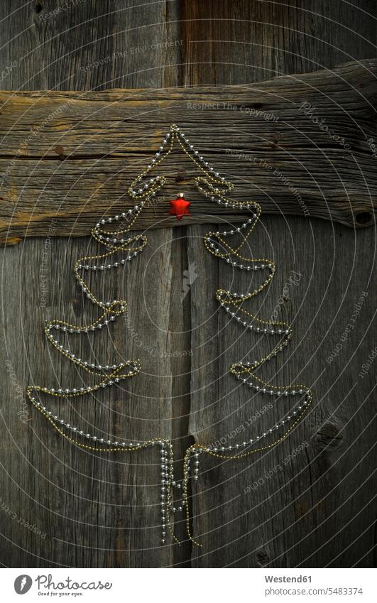 Christmas tree shaped of chains on wood decoration decorating decorations Christmas decoration Christmas decorations celebration social event celebrations