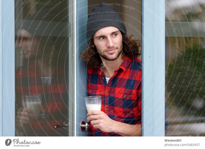 Portrait of young man with glass of milk caucasian caucasian ethnicity caucasian appearance european casual leisure wear casual clothing casual wear