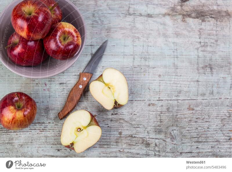 Whole and sliced red apples and a kitchen knife on wood Shabby chic rich in vitamines gleaming still life still-lifes still lifes Kitchen Knife Kitchen Knives