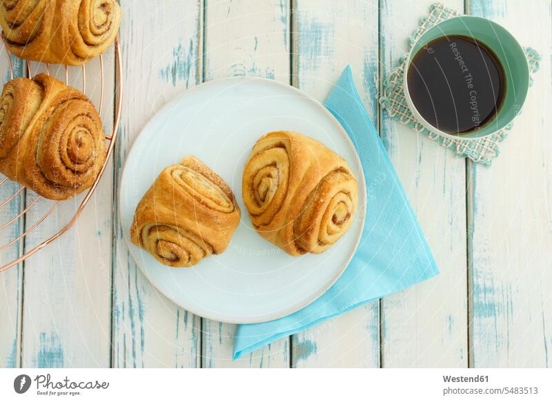 Home-baked Franzbroetchen and cup of coffee Pastry Pastries Coffee Coffee Cup Coffee Cups rolled rolling filled white Napkin Serviette Serviettes Napkins Plate