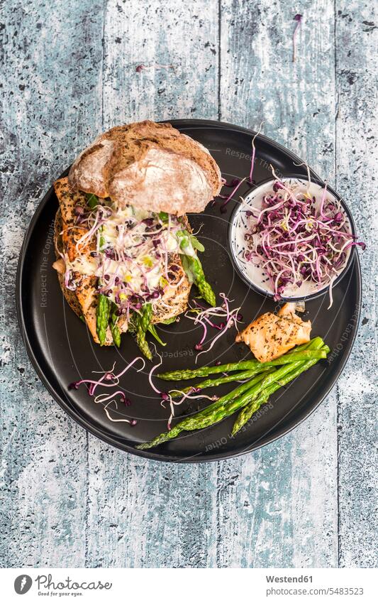 Salmon burger with green asparagus and red cress on plate Plate dish dishes Plates cresses crisp crunchy ready to eat ready-to-eat sandwich open-faced sandwich