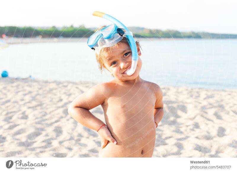Portrait of little boy with diving goggles and snorkel on the beach beaches boys males portrait portraits child children kid kids people persons human being