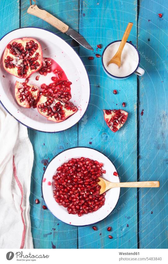 Enamel dish of pomegranate seed pomegranate seeds food and drink Nutrition Alimentation Food and Drinks Cup Cups overhead view from above top view Overhead