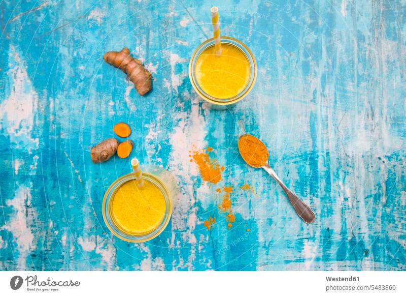 Two glasses of curcuma milk food and drink Nutrition Alimentation Food and Drinks overhead view from above top view Overhead Overhead Shot View From Above