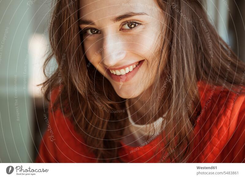 Portrait of smiling young woman smile portrait portraits females women Adults grown-ups grownups adult people persons human being humans human beings cheerful